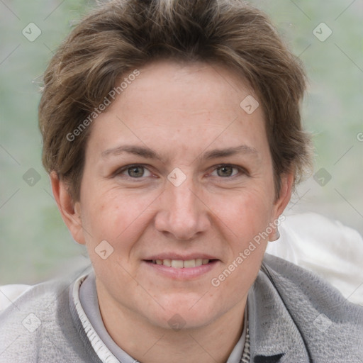 Joyful white adult female with short  brown hair and grey eyes