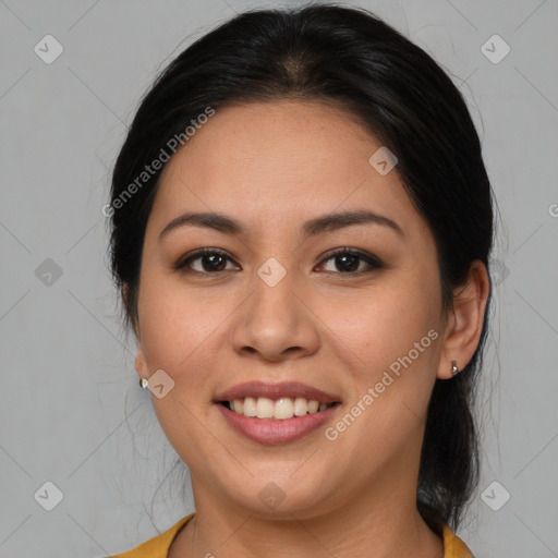 Joyful latino young-adult female with medium  brown hair and brown eyes