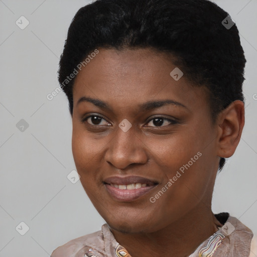 Joyful black young-adult female with short  brown hair and brown eyes