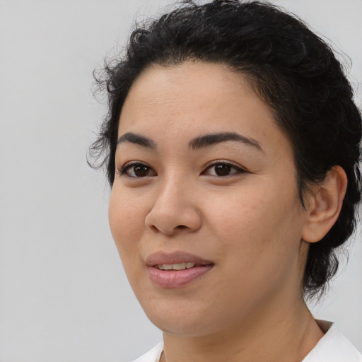 Joyful white young-adult female with medium  black hair and brown eyes