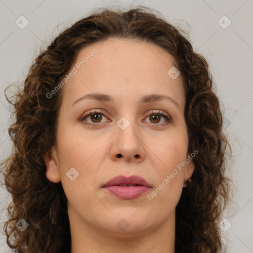 Joyful white adult female with long  brown hair and brown eyes