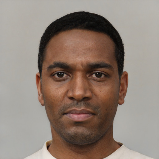 Neutral black young-adult male with short  black hair and brown eyes