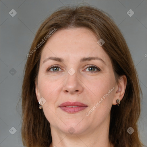 Joyful white adult female with long  brown hair and grey eyes