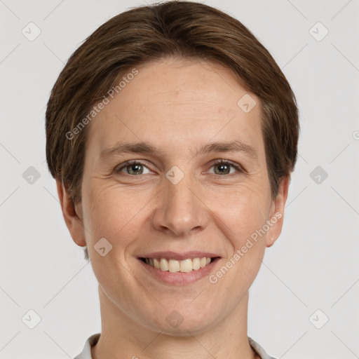 Joyful white adult female with short  brown hair and grey eyes