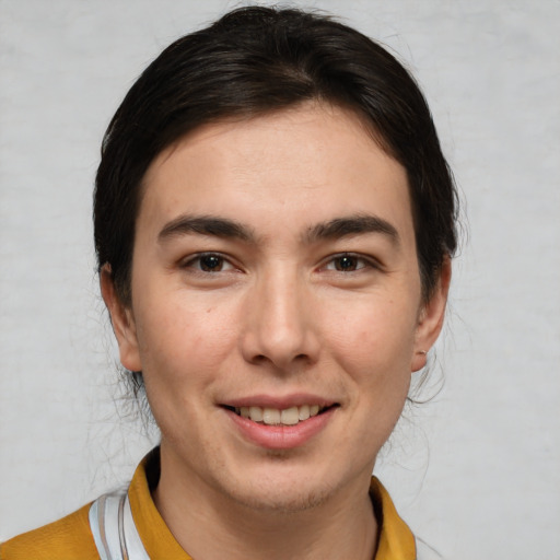 Joyful white young-adult male with medium  brown hair and brown eyes