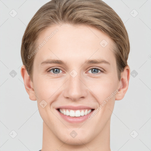 Joyful white young-adult female with short  brown hair and grey eyes