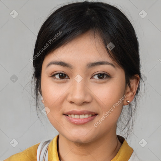 Joyful asian young-adult female with medium  brown hair and brown eyes