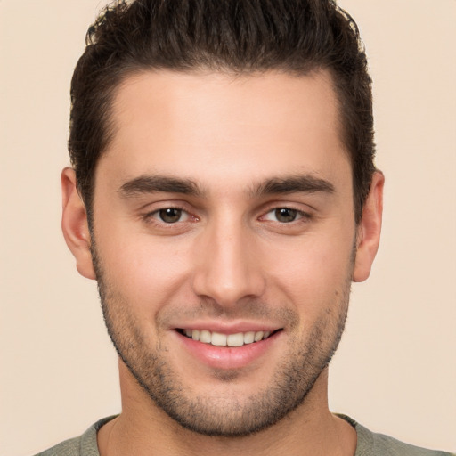 Joyful white young-adult male with short  brown hair and brown eyes