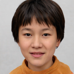 Joyful asian child female with short  brown hair and brown eyes