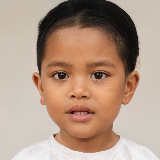Joyful asian child female with short  brown hair and brown eyes