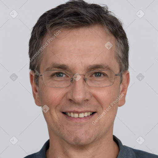 Joyful white adult male with short  brown hair and grey eyes