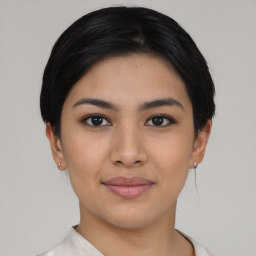 Joyful asian young-adult female with short  black hair and brown eyes