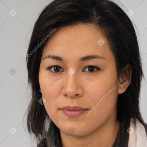 Joyful asian young-adult female with long  brown hair and brown eyes