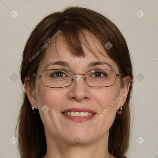 Joyful white adult female with medium  brown hair and blue eyes