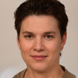 Joyful white adult female with short  brown hair and brown eyes