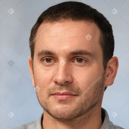 Joyful white young-adult male with short  brown hair and brown eyes