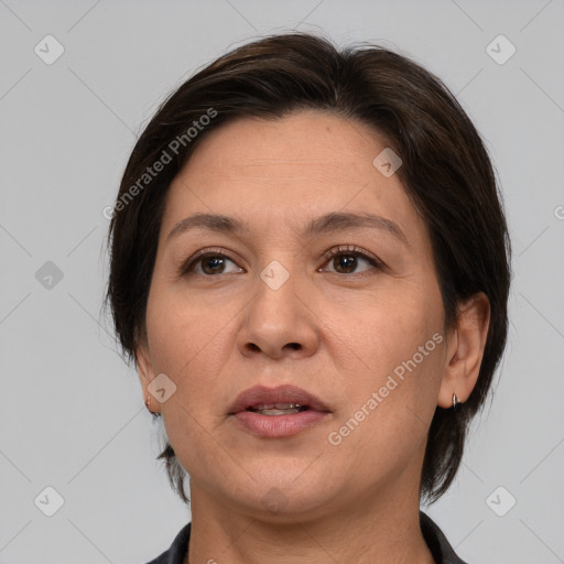 Joyful white adult female with medium  brown hair and brown eyes