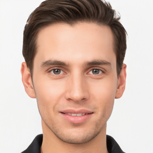 Joyful white young-adult male with short  brown hair and brown eyes