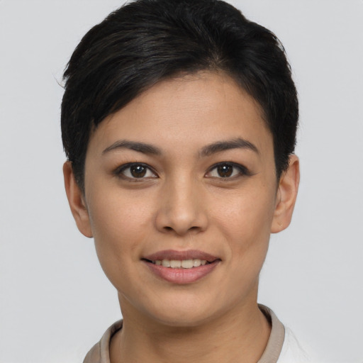 Joyful asian young-adult female with short  brown hair and brown eyes