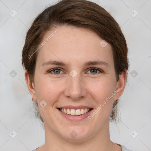 Joyful white young-adult female with medium  brown hair and grey eyes