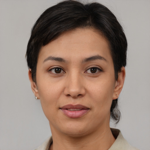 Joyful asian young-adult female with short  brown hair and brown eyes