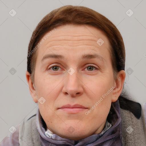 Joyful white young-adult female with short  brown hair and grey eyes