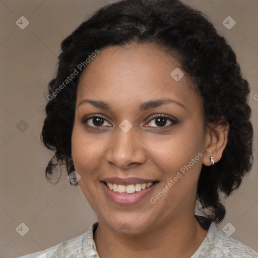 Joyful black young-adult female with medium  brown hair and brown eyes