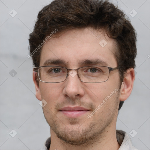 Joyful white adult male with short  brown hair and grey eyes