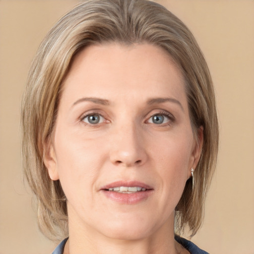 Joyful white adult female with medium  brown hair and grey eyes