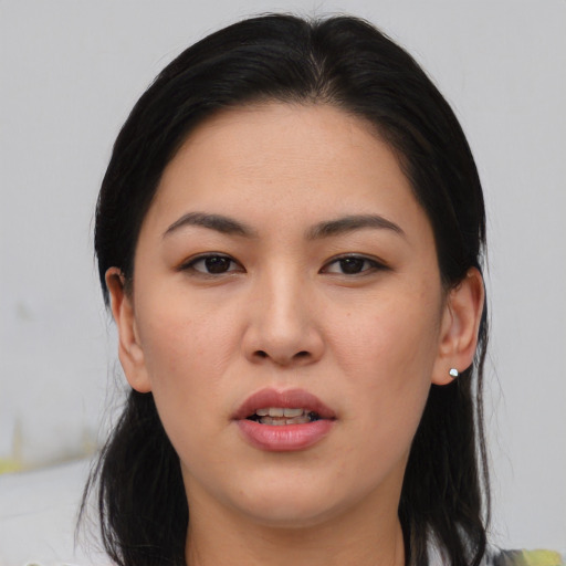 Joyful asian young-adult female with medium  brown hair and brown eyes