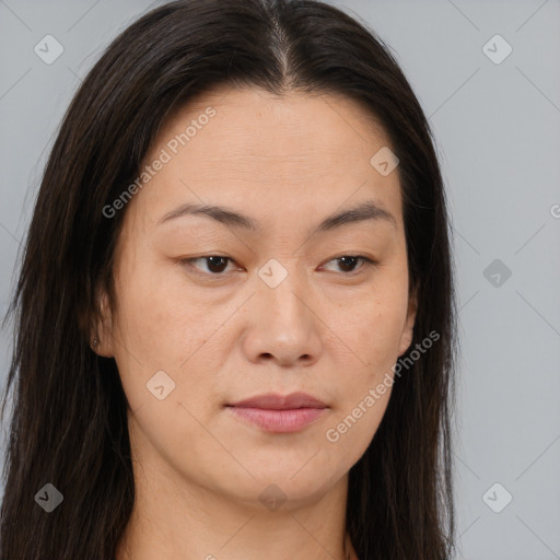 Joyful asian young-adult female with long  brown hair and brown eyes