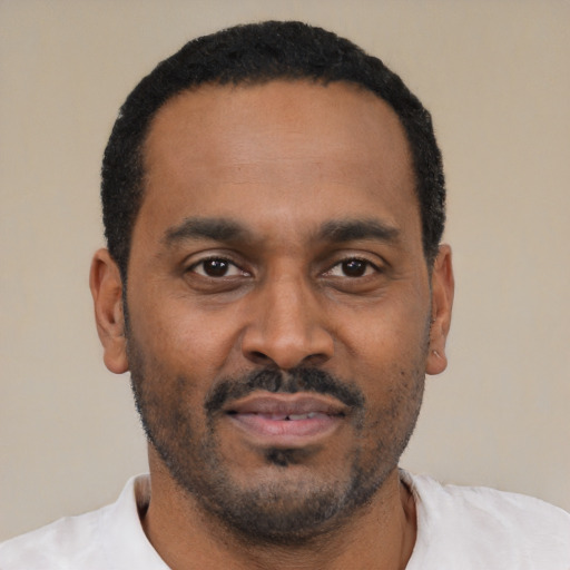 Neutral latino adult male with short  black hair and brown eyes