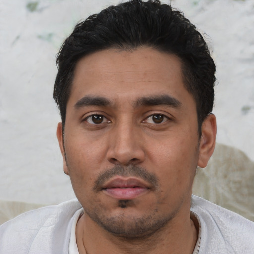 Neutral latino young-adult male with short  black hair and brown eyes