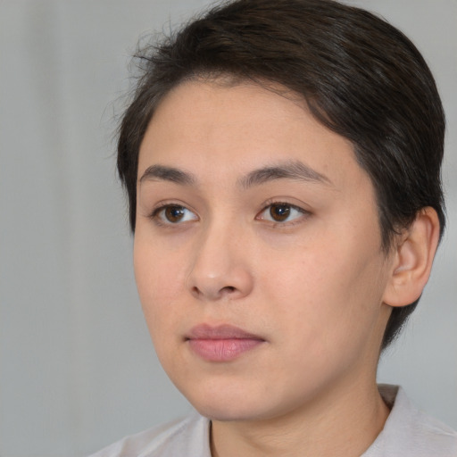 Neutral white young-adult female with short  brown hair and brown eyes
