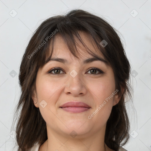 Joyful white adult female with medium  brown hair and brown eyes