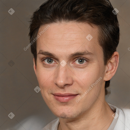 Joyful white adult male with short  brown hair and brown eyes