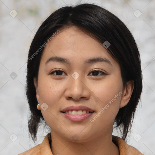 Joyful asian young-adult female with medium  black hair and brown eyes