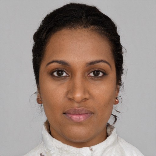 Neutral black young-adult female with medium  brown hair and brown eyes