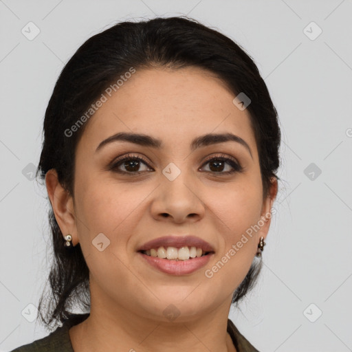 Joyful latino young-adult female with medium  brown hair and brown eyes