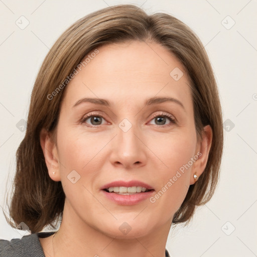 Joyful white adult female with medium  brown hair and grey eyes