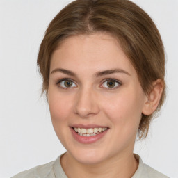 Joyful white young-adult female with medium  brown hair and grey eyes