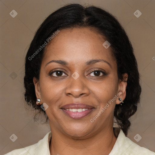 Joyful black adult female with medium  brown hair and brown eyes