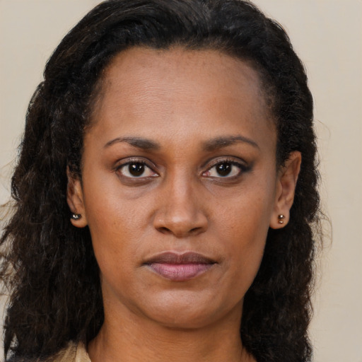 Neutral latino young-adult female with long  brown hair and brown eyes
