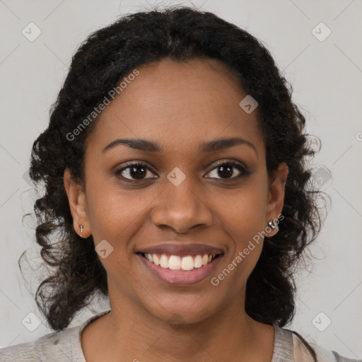 Joyful black young-adult female with medium  brown hair and brown eyes