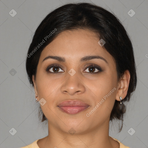 Joyful latino young-adult female with medium  brown hair and brown eyes