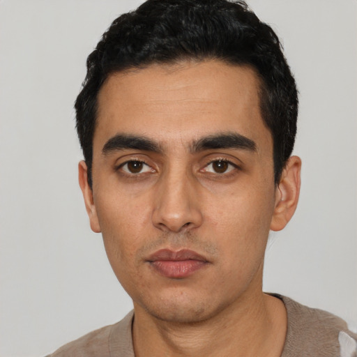 Neutral latino young-adult male with short  black hair and brown eyes