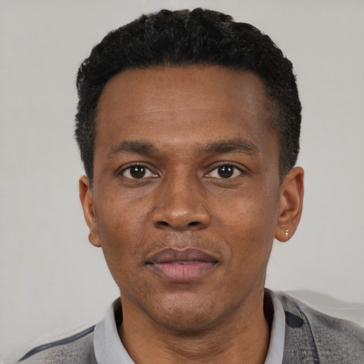 Neutral black adult male with short  black hair and brown eyes