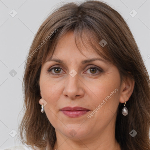 Joyful white adult female with medium  brown hair and grey eyes