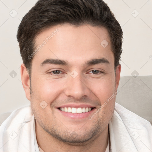 Joyful white young-adult male with short  brown hair and brown eyes