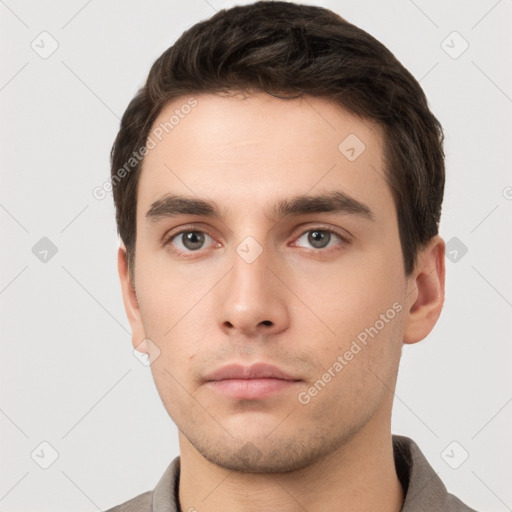 Neutral white young-adult male with short  brown hair and brown eyes